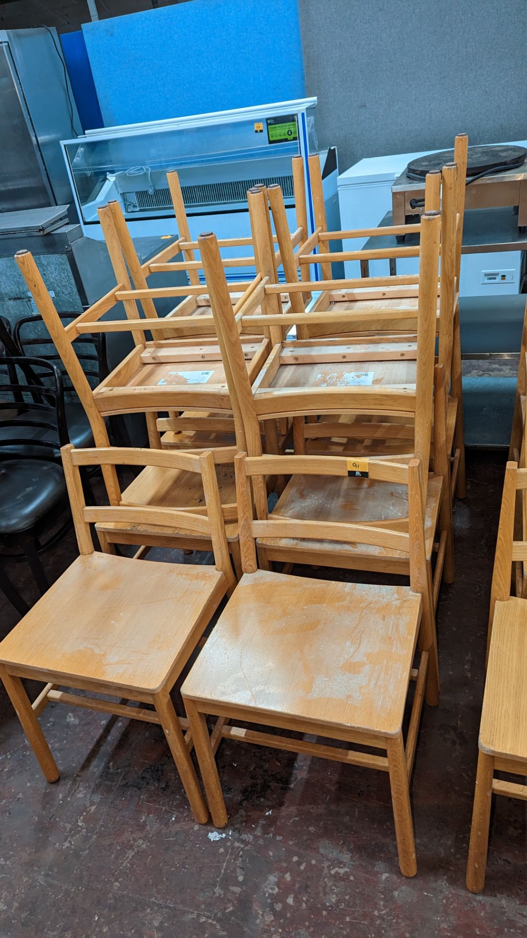 10 matching wooden dining chairs. NB lots 90 & 91 comprise different quantities of matching chairs