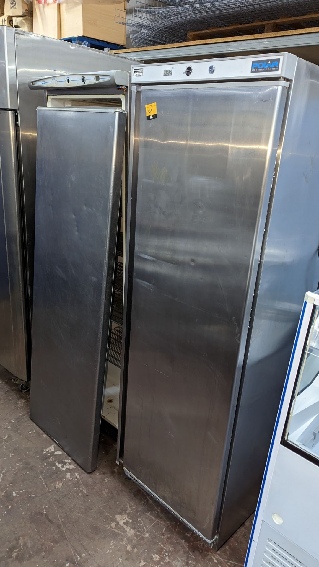 2 off tall stainless steel freezers. NB one freezer is damaged