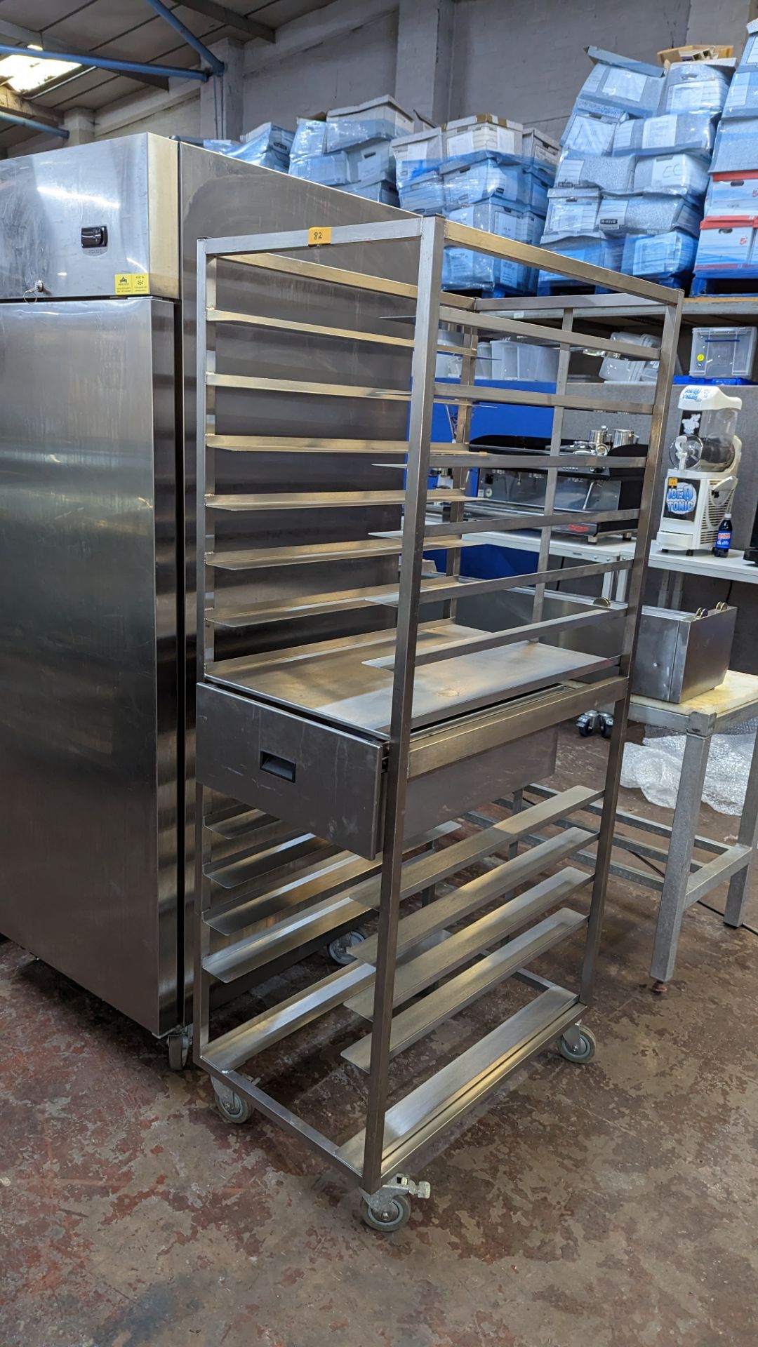 Stainless steel deep tray holding trolley with pull-out drawer