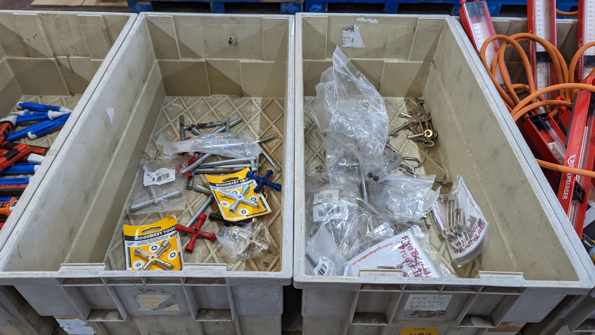 The contents of 2 crates of assorted keys, for cabinets and emergency access doors and meters and mo
