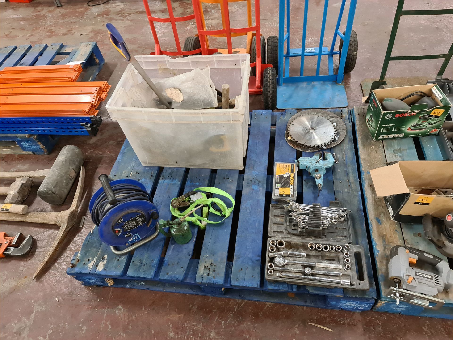 Total contents of a pallet of handtools and consumables including socket set, circular saw blades, r