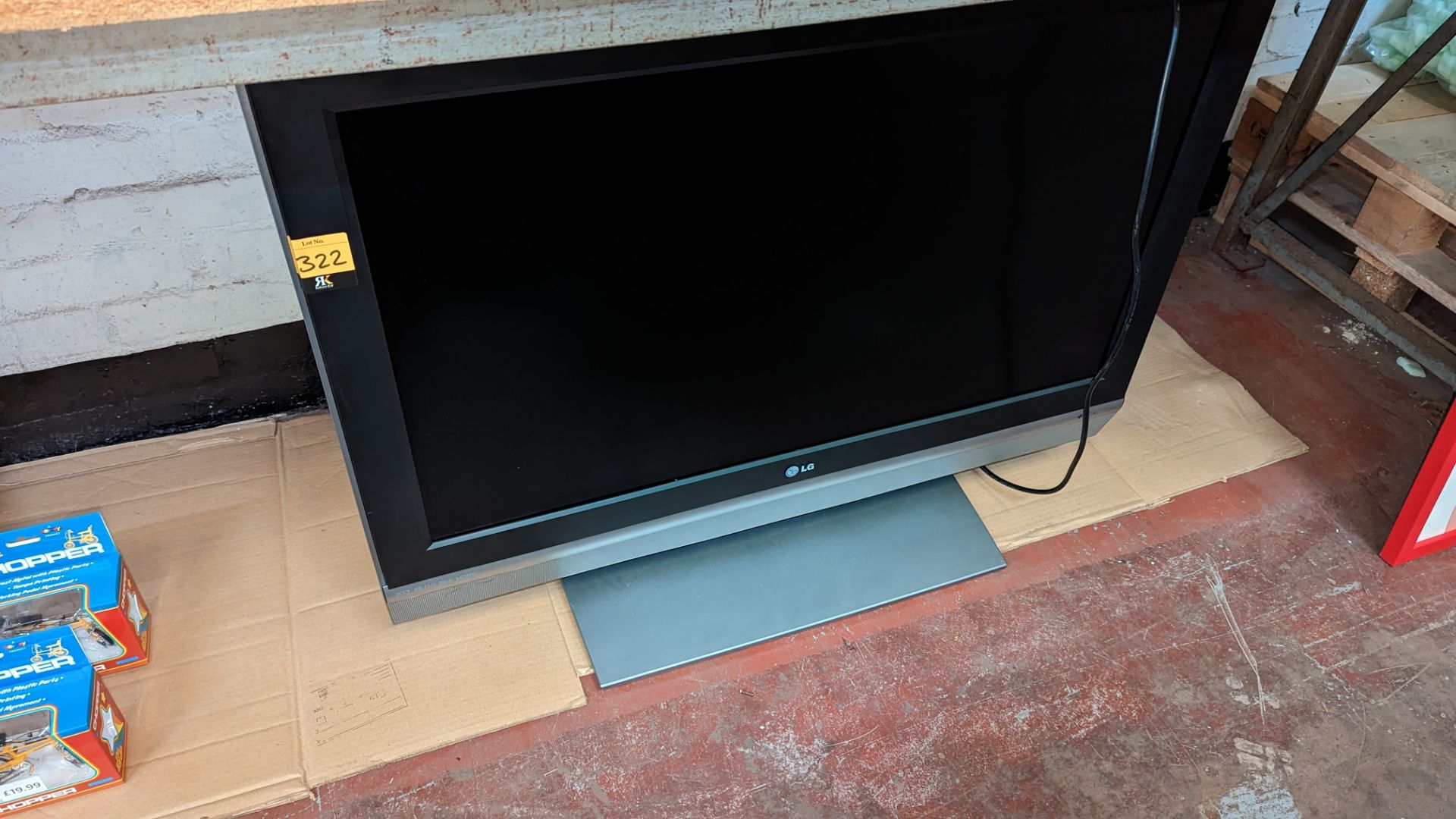 LG 37" LCD flat panel TV on desktop stand, including remote control