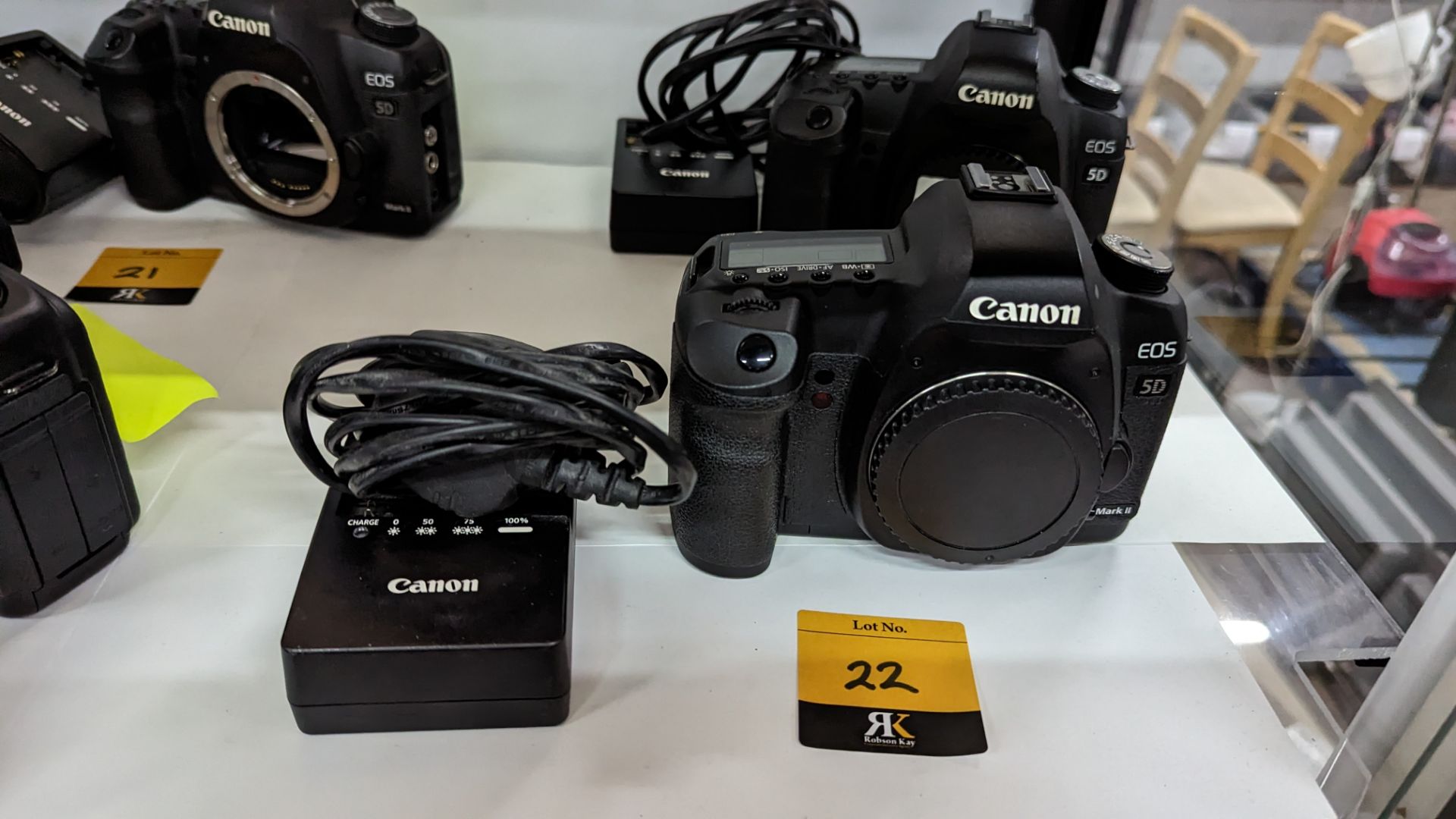Canon EOS 5D Mark II digital camera plus Canon battery charger. N.B. no lens or battery included wi