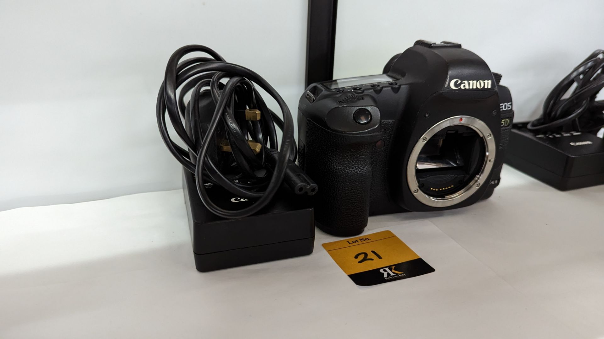 Canon EOS 5D Mark II digital camera plus Canon battery charger. N.B. no lens or battery included wi