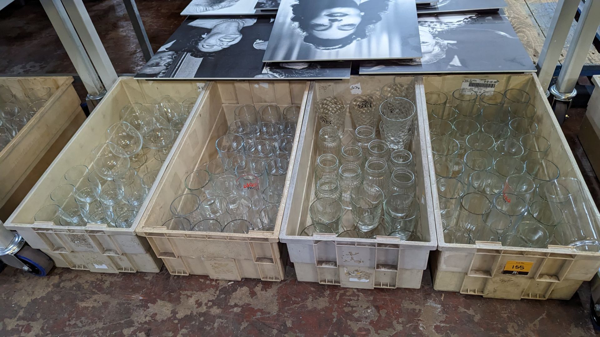 The contents of 4 crates of assorted tumblers, jars, brandy snifters, wine glasses and other glasswa