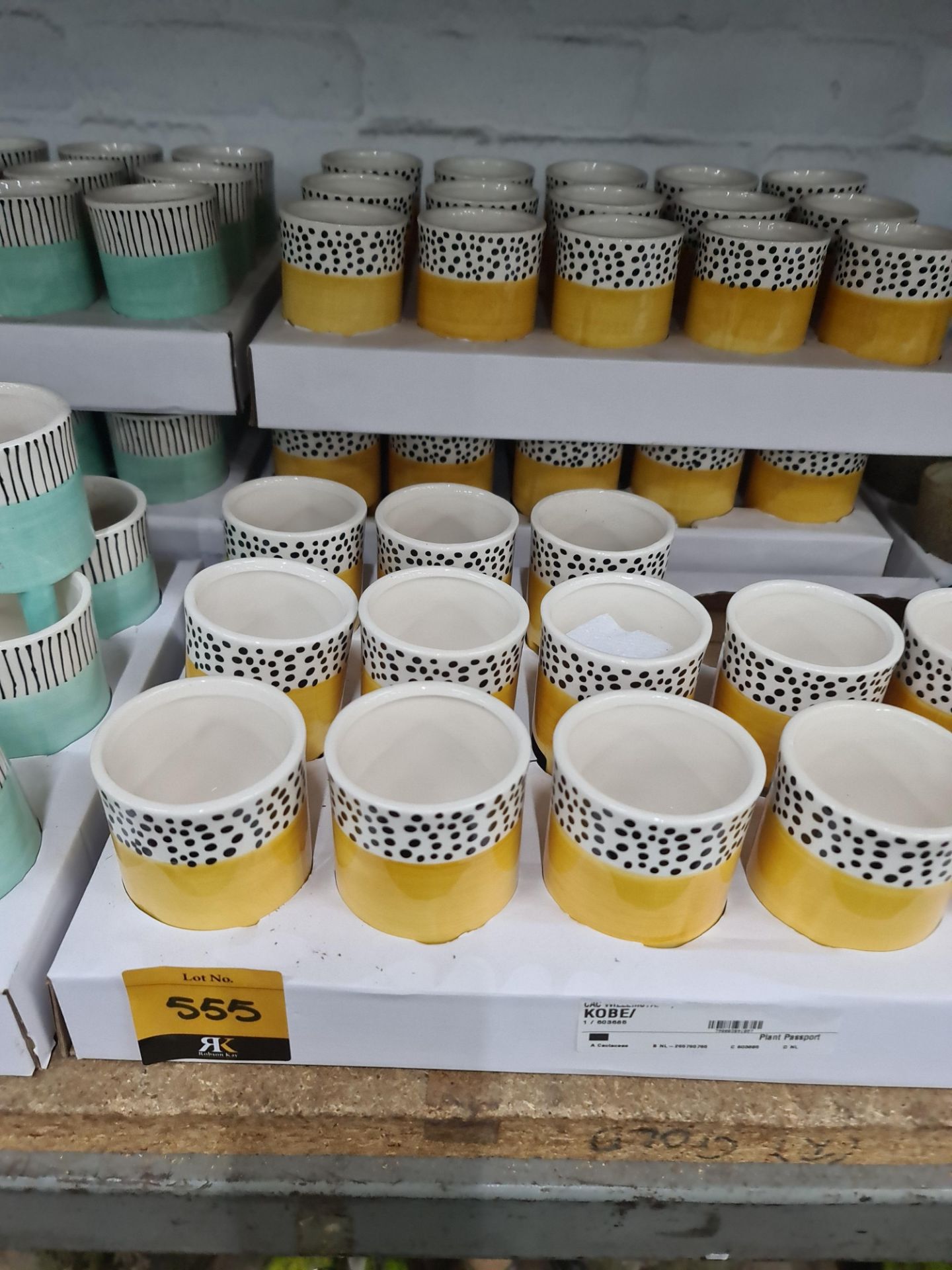 3 trays of Kobe yellow patterned pots each standing on 3 legs, approximately 43 pots in total