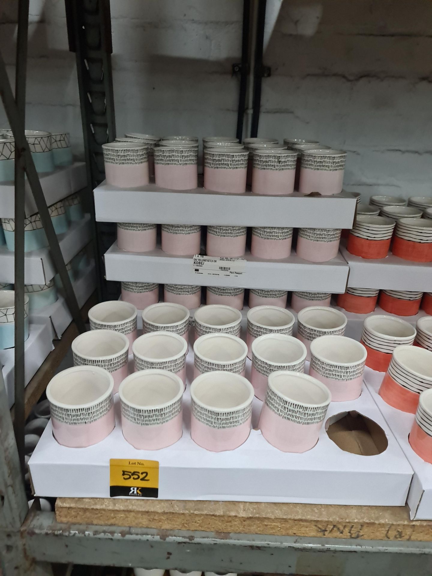 4 trays of Kobe 5.5cm pink patterned pots each standing on 3 legs, approximately 59 pots in total