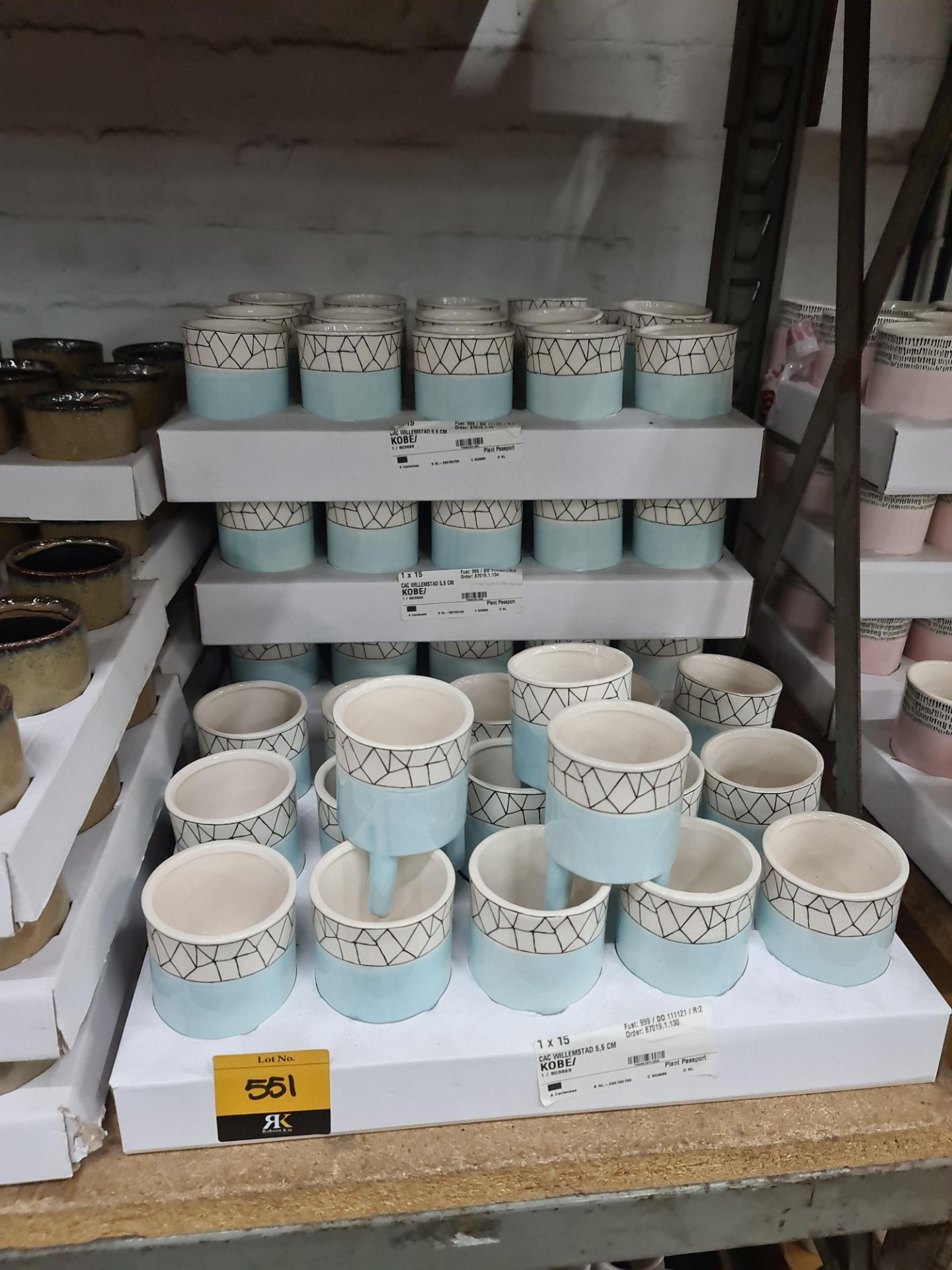 4 trays of Kobe 5.5cm blue patterned pots each standing on 3 legs, approximately 63 pots in total