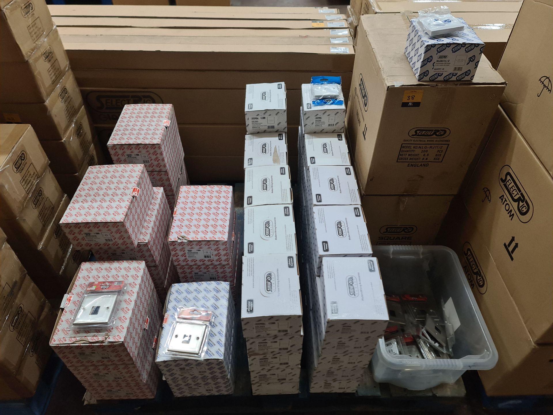 The contents of a pallet of RJ11 sockets. This lot includes a large quantity of satin chrome socket