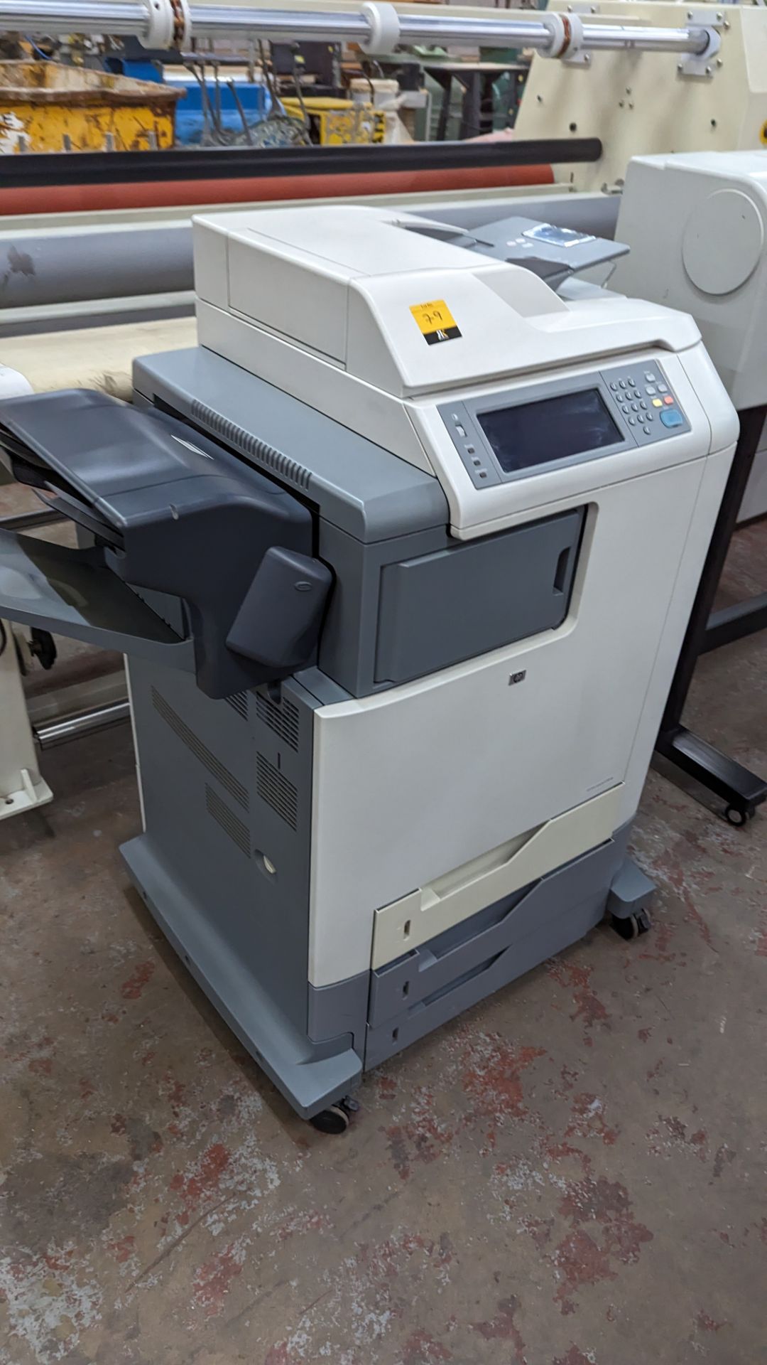 HP colour LaserJet model CM4730MFP large floor standing colour printer incorporating multiple paper