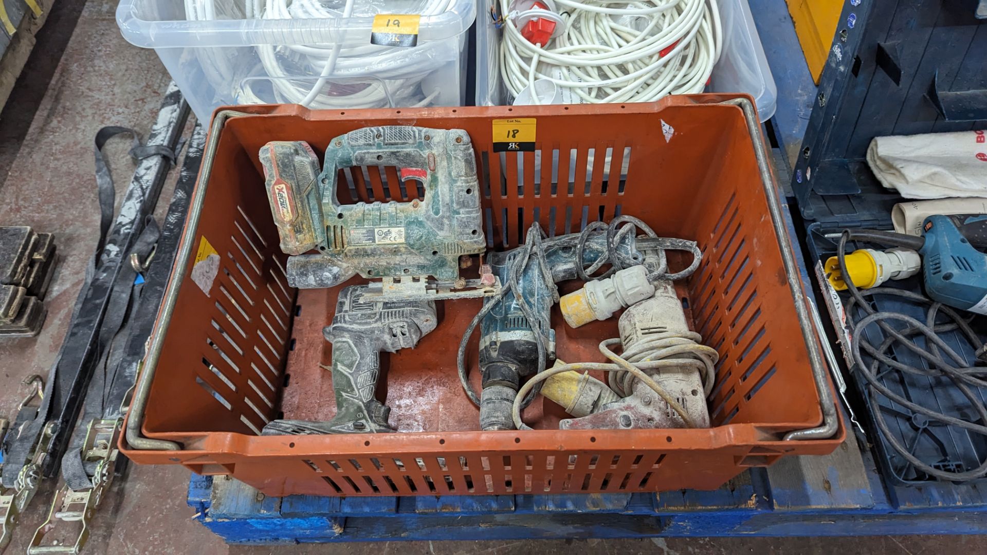 The contents of a crate of assorted power tools including 110V & cordless