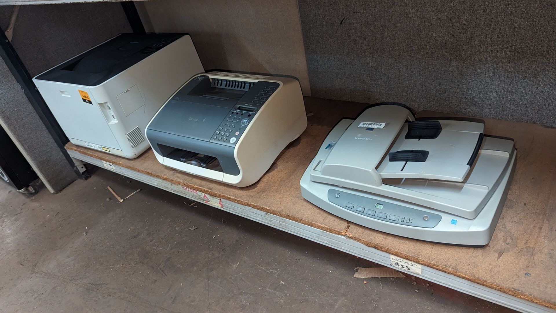 The contents of a bay of assorted IT equipment comprising laser printer, Canon fax machine & HP scan