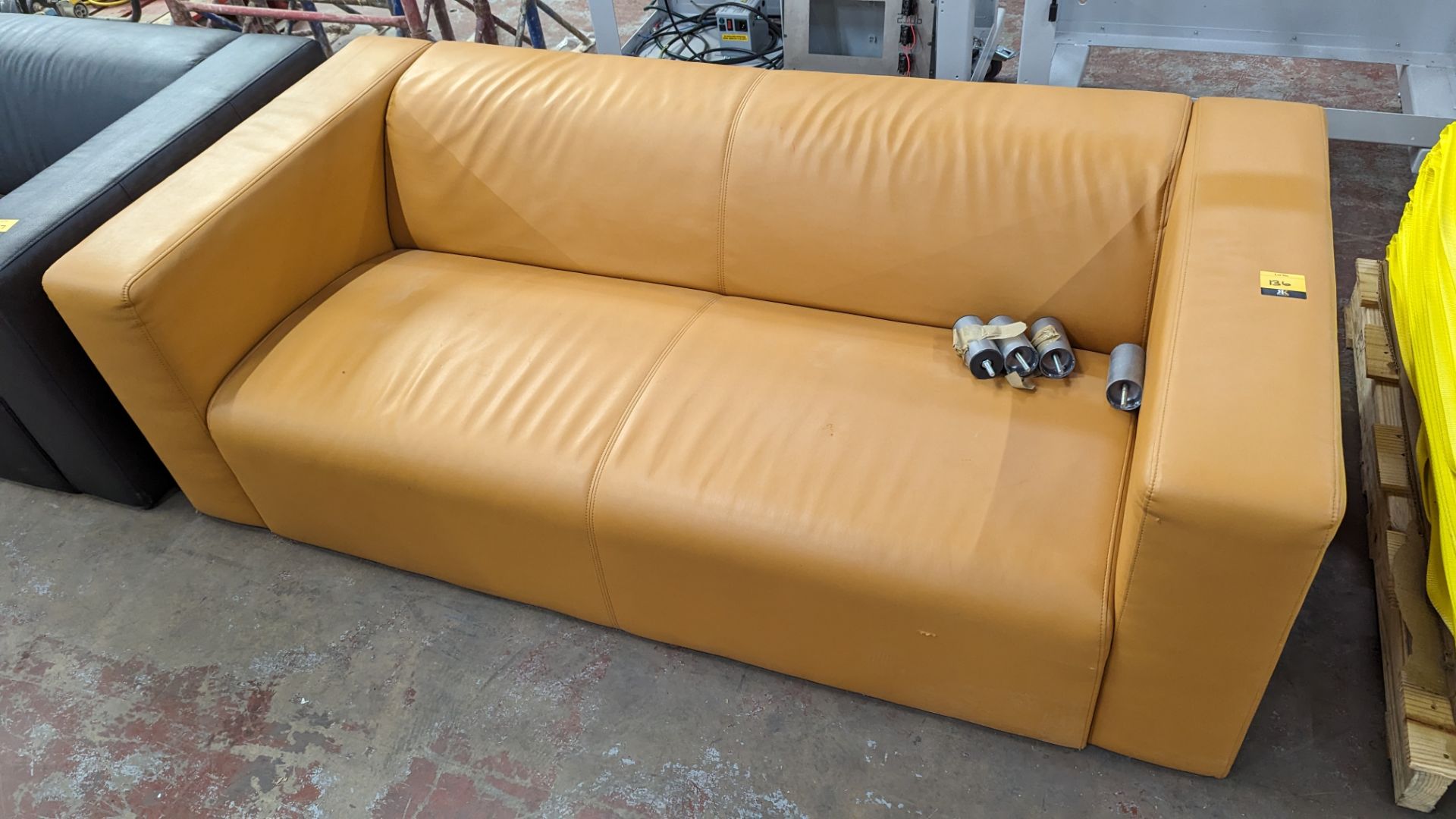 Tan leather/leather look sofa