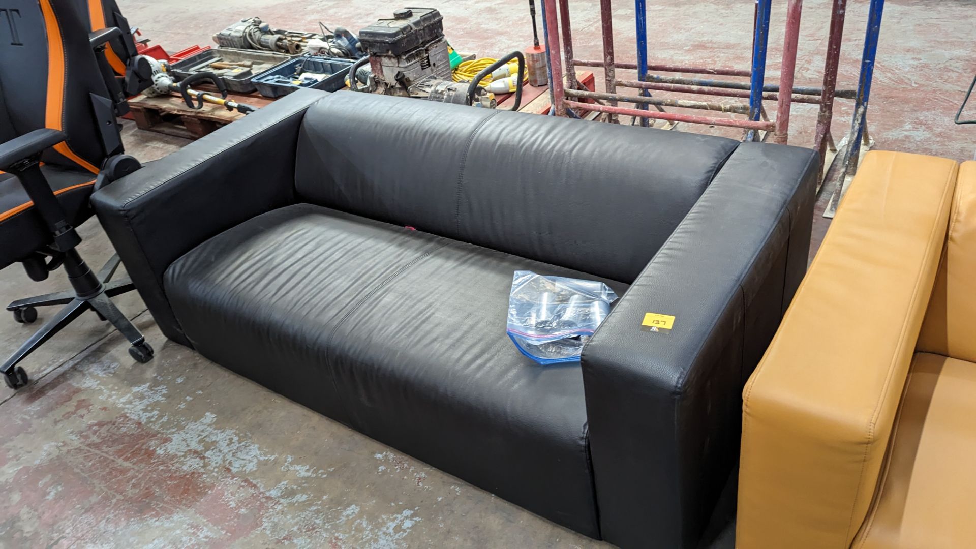 Black leather/leather look sofa