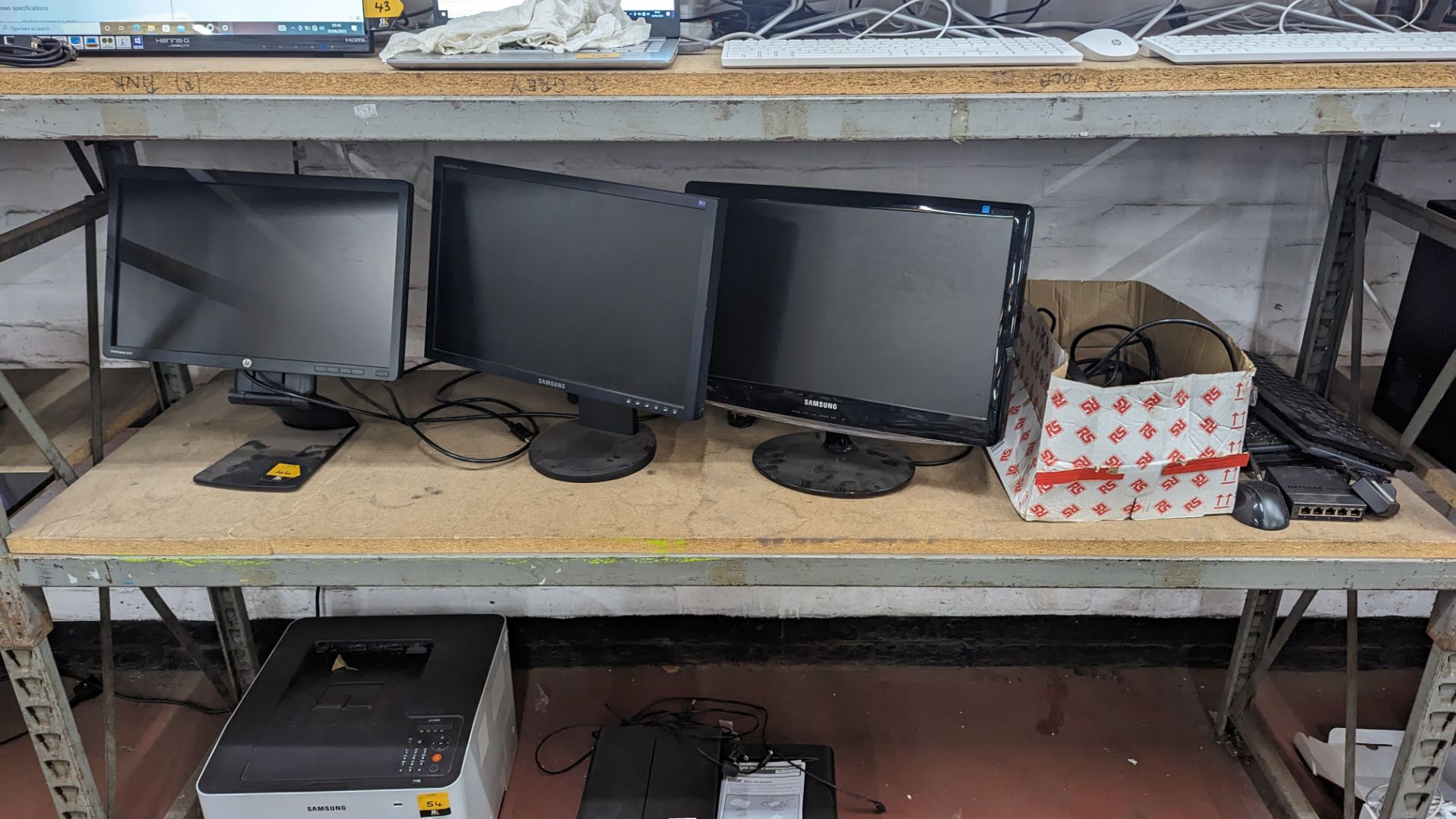 The contents of a shelf of assorted IT equipment including monitors, cables, keyboards, headphones & - Image 2 of 10