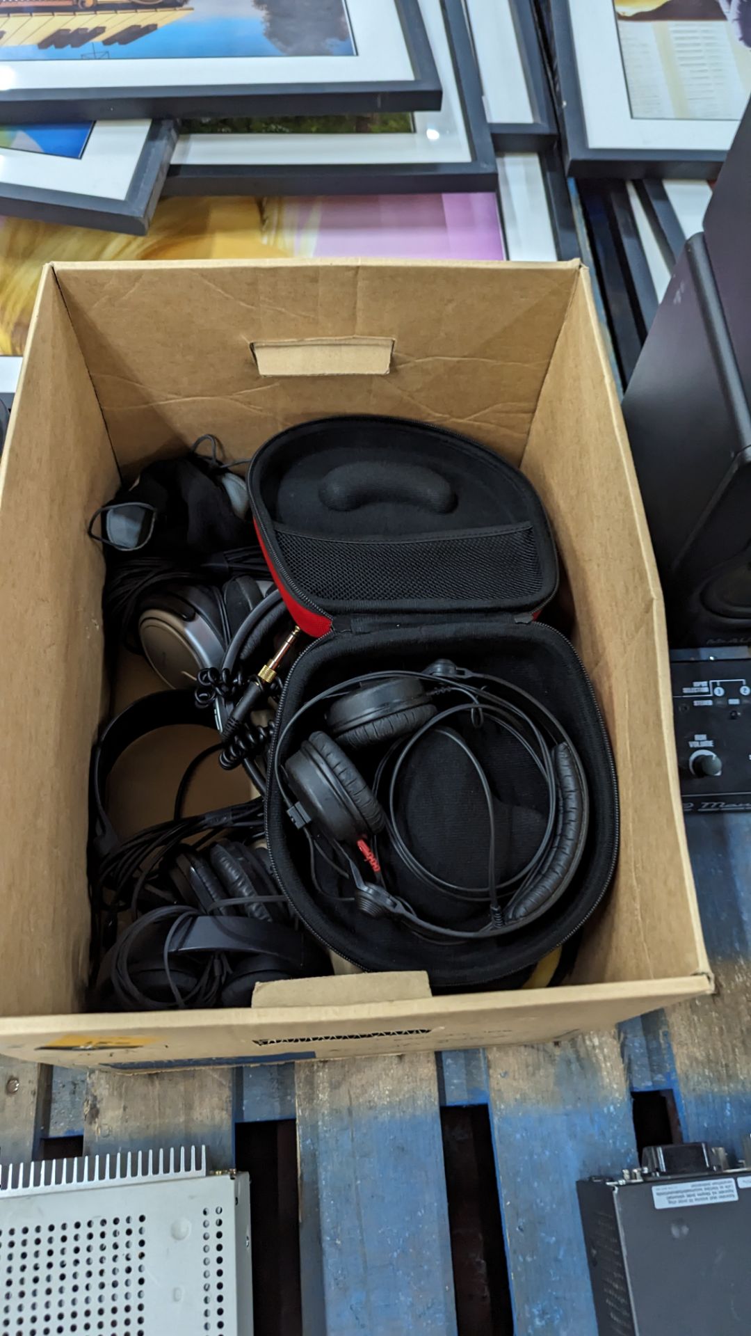 Box of headphones including Sennheiser HD25S in hard case