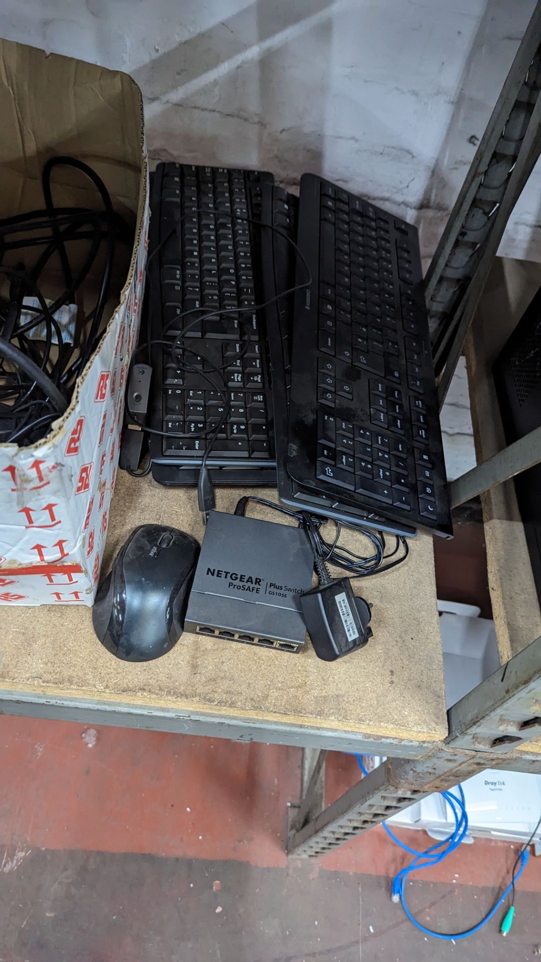 The contents of a shelf of assorted IT equipment including monitors, cables, keyboards, headphones & - Image 8 of 10