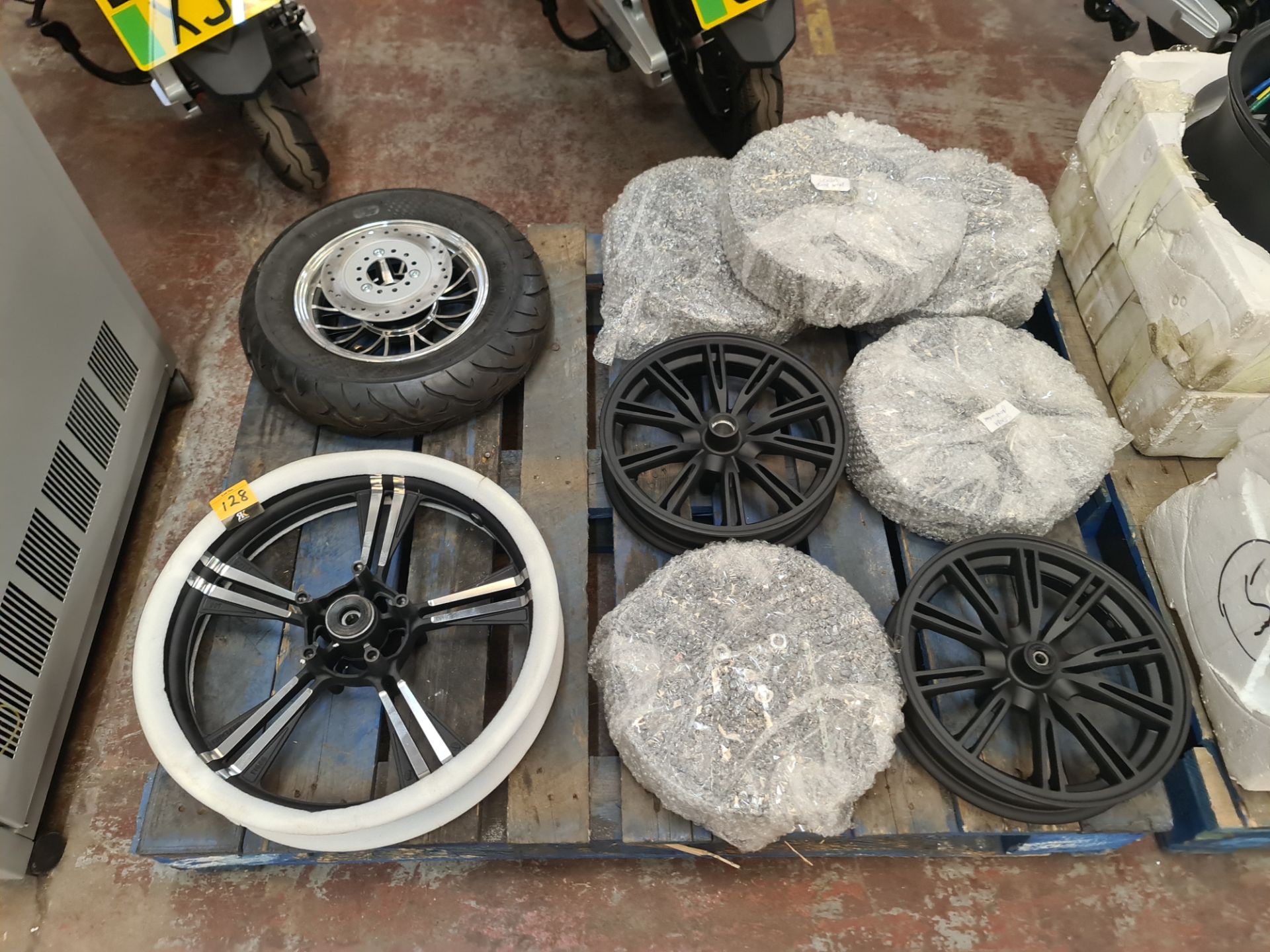 9 off assorted bike front wheels, the contents of a pallet