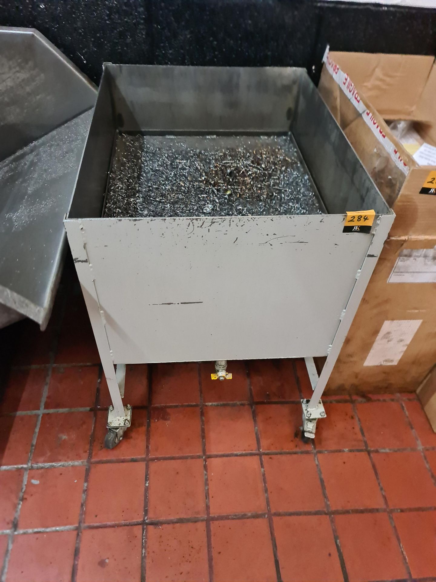 Mobile metal scraps bin with filtration system and tap. NB lots 281 to 287 comprise items that were