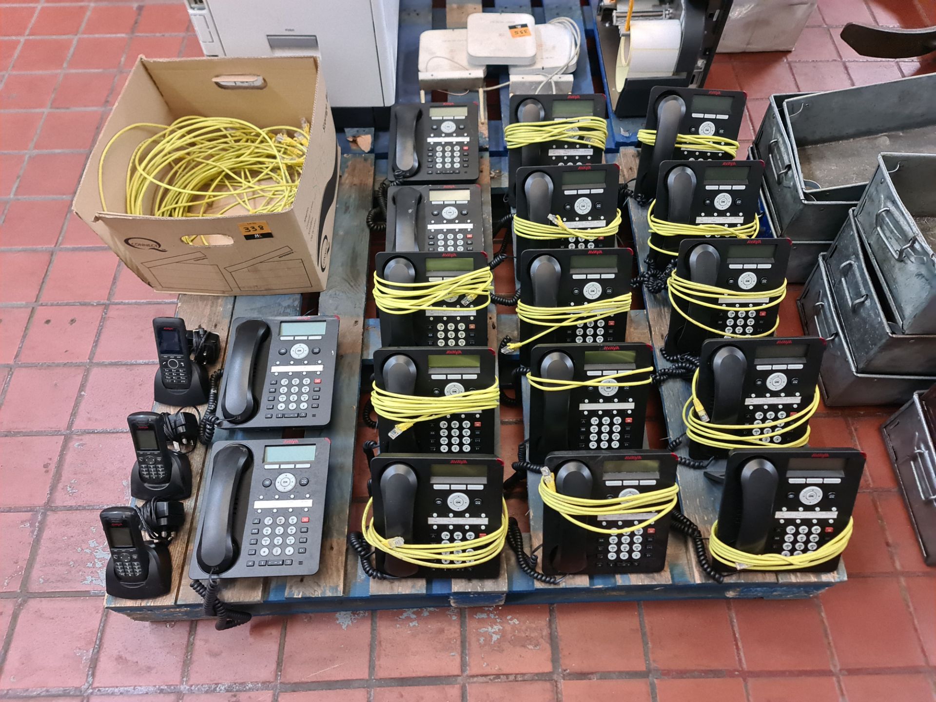 Contents of a pallet of telephone equipment, comprising 17 Avaya wired handsets, 3 Avaya DECT handse