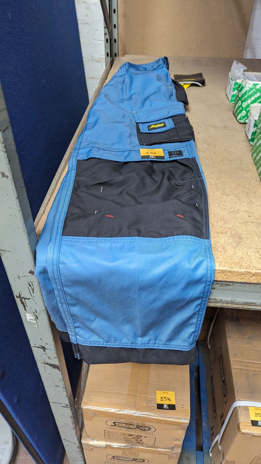 Pair of Snickers work trousers size 048, colour ocean/black 1704, craftsmen trouser dura twill