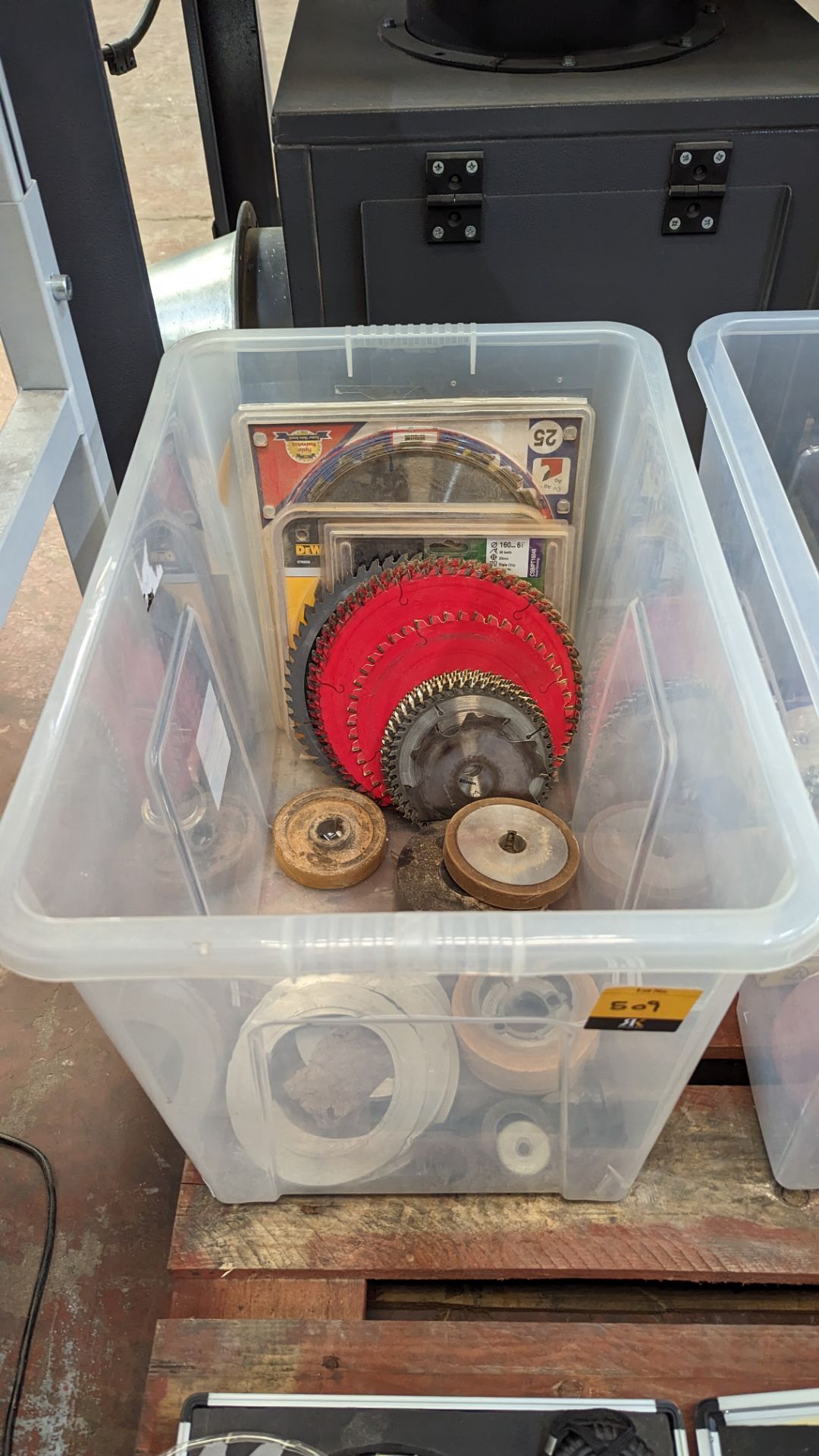 The contents of a crate of circular saw blades, abrasive discs & more