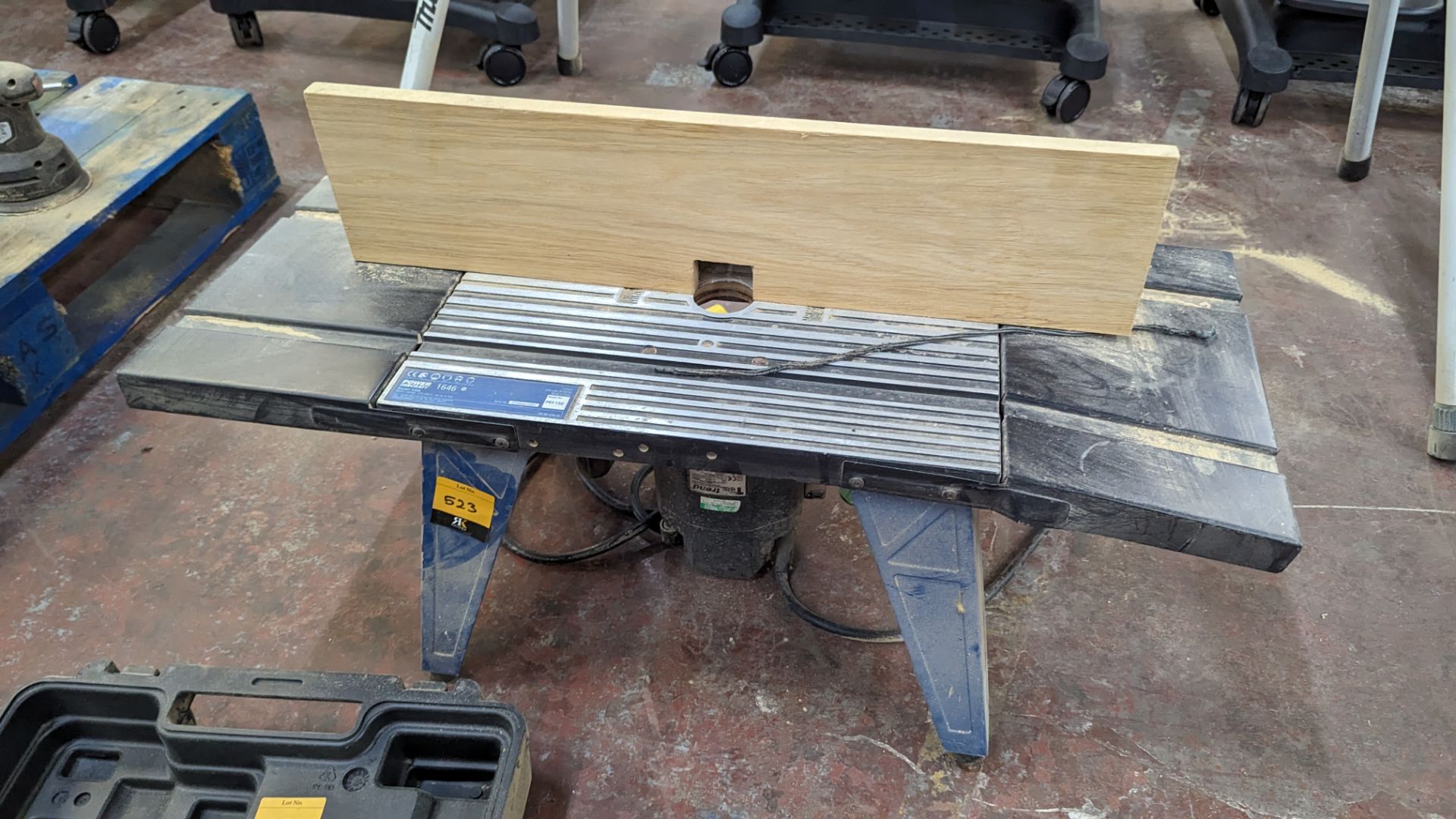 Trend 110V router including router table to which it is mounted