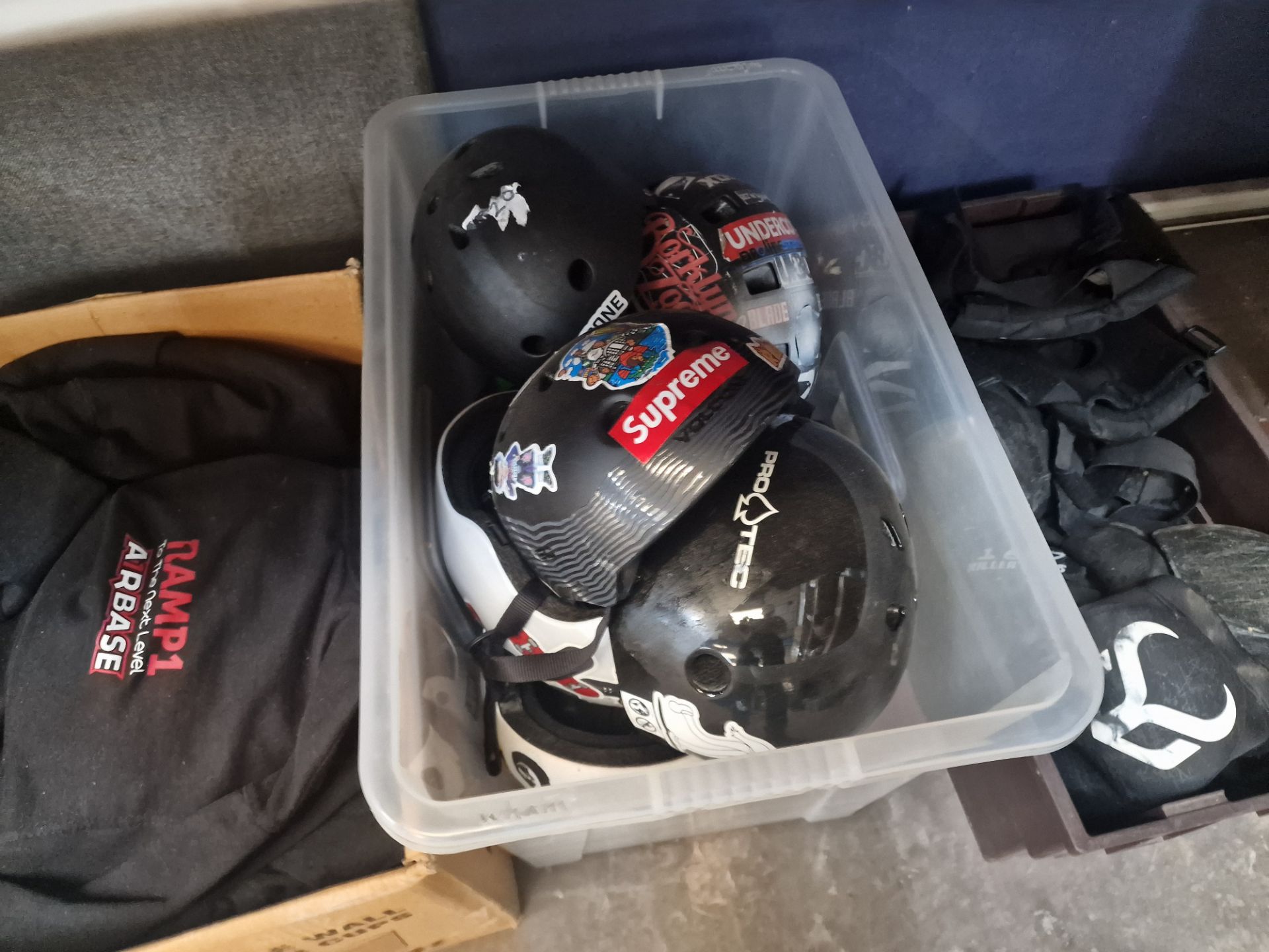 Assorted skateboard related items comprising clothing plus the contents of a crate of helmets and th - Image 3 of 4