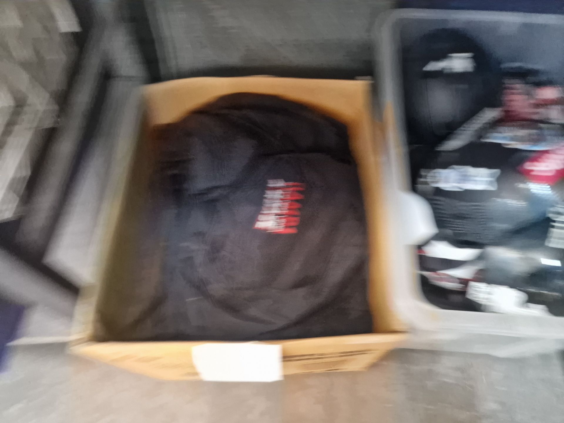 Assorted skateboard related items comprising clothing plus the contents of a crate of helmets and th - Image 2 of 4