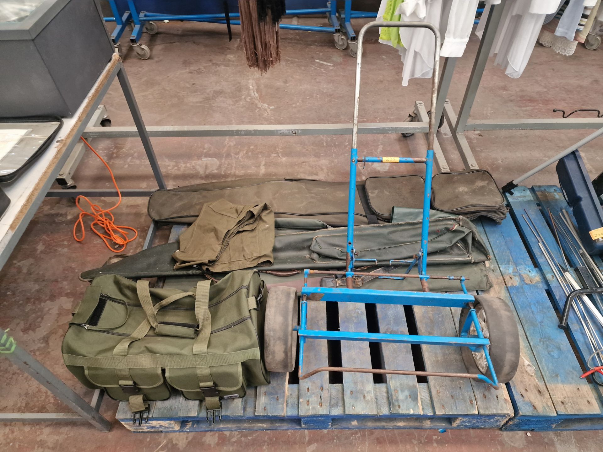 Fishing lot: the contents of a pallet. This lot comprises a trolley, carry bag for use with same, q
