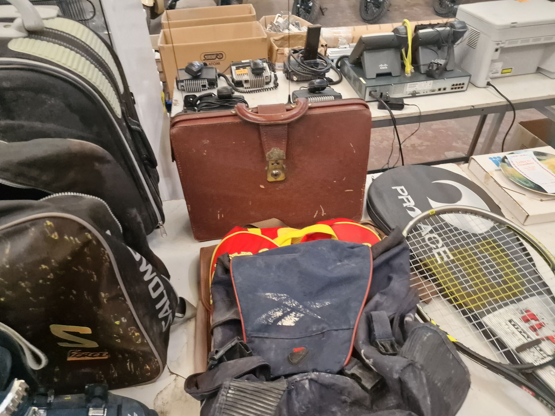 The contents of a table comprising a pair of ski boots and a bag, quantity of luggage, 2 off rackets - Image 6 of 7