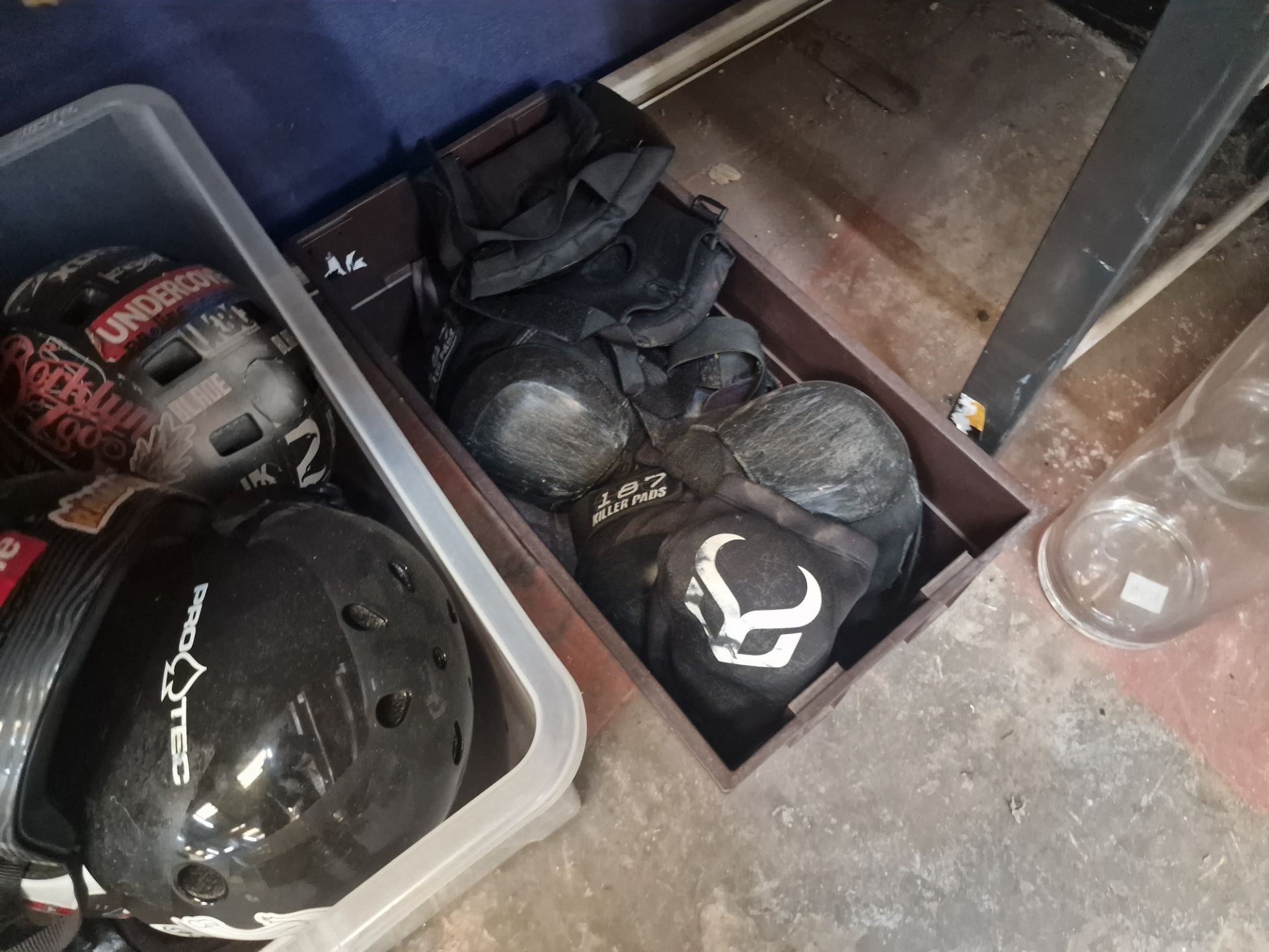 Assorted skateboard related items comprising clothing plus the contents of a crate of helmets and th - Image 4 of 4