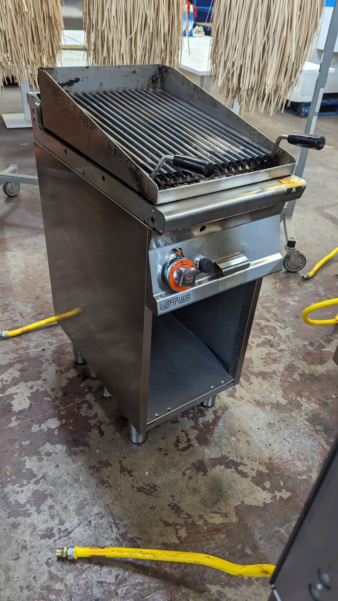 Lotus CW-74g stainless steel chargrill unit on open cabinet, measuring 400mm wide x 700mm. Please n