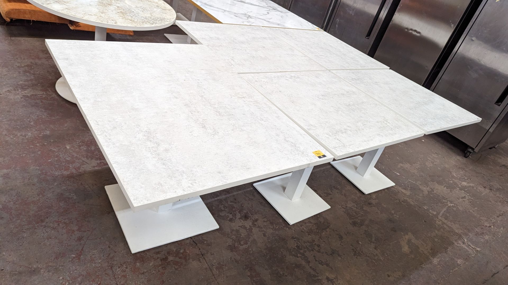 5 off matching dining tables, with marble effect top, all on a single pedestal base. 4 of the table