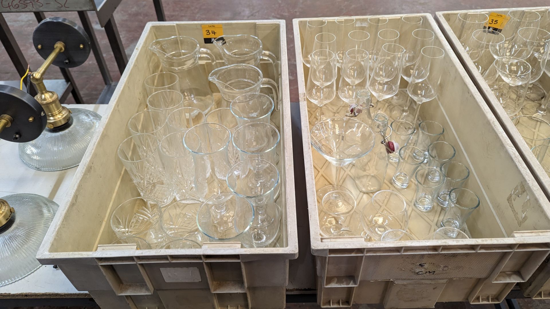 The contents of 2 crates of glassware including jugs, tumblers, dessert glasses, brandy glasses and