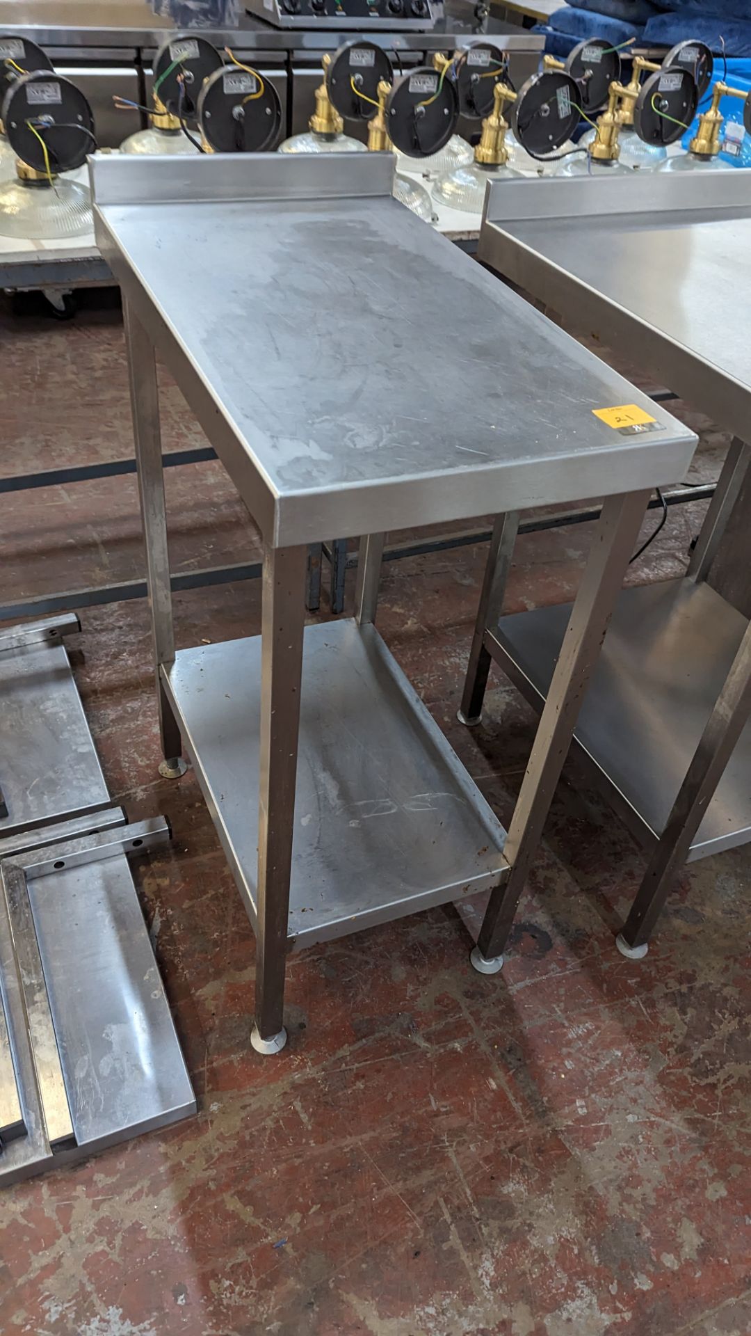 Stainless steel 'wall table' with undershelf, measuring 400mm wide x 700mm deep