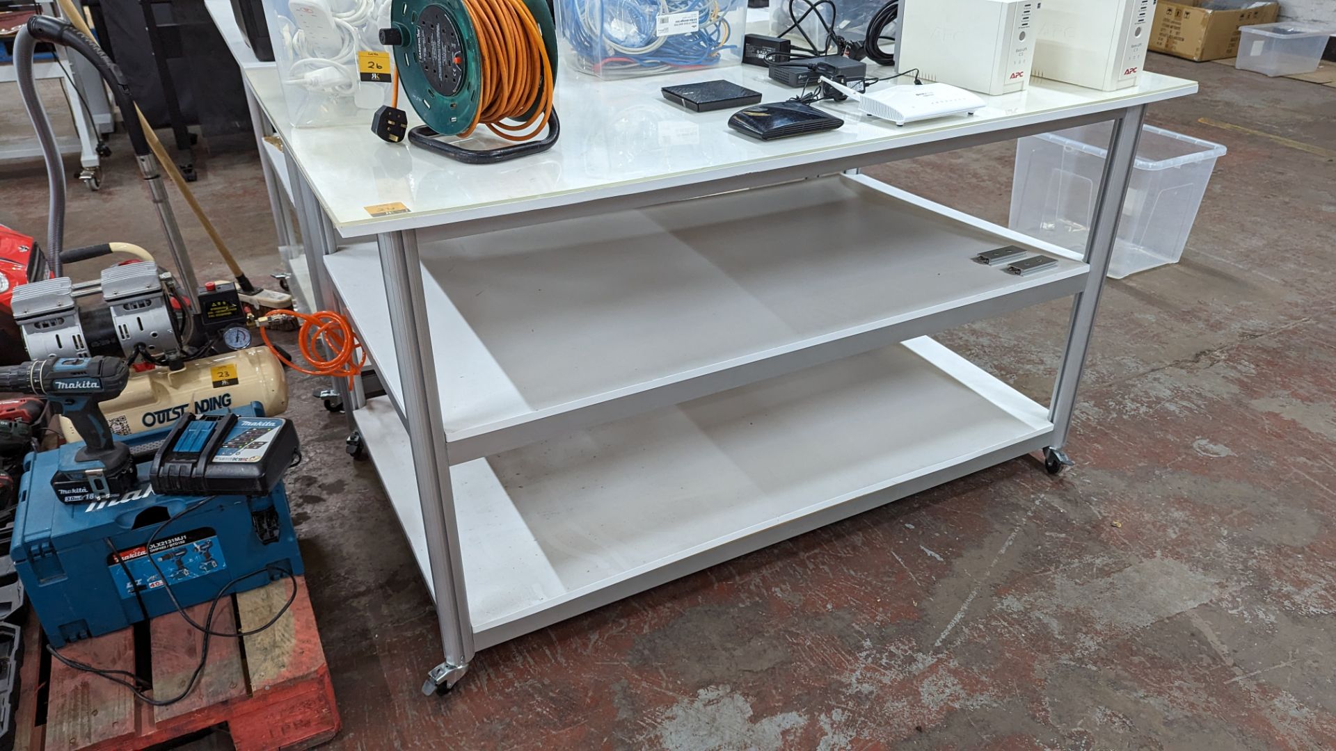 Mobile worktable with 2 shelves underneath the main work surface. Includes protective sheet in very - Image 2 of 9