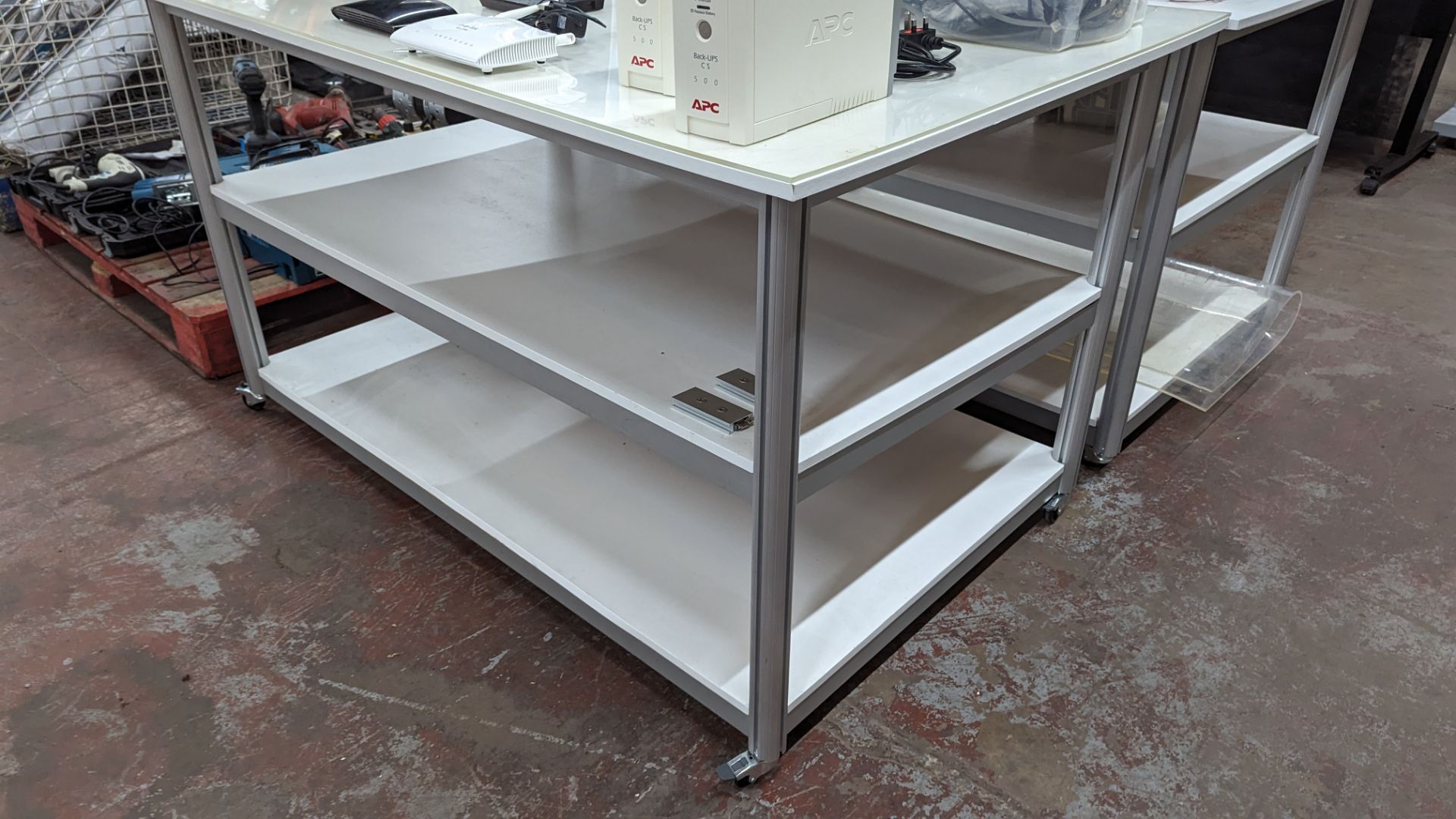 Mobile worktable with 2 shelves underneath the main work surface. Includes protective sheet in very - Image 8 of 9