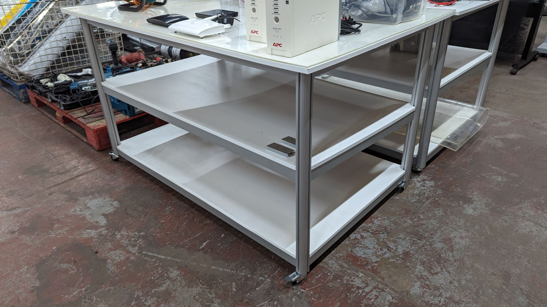 Mobile worktable with 2 shelves underneath the main work surface. Includes protective sheet in very - Image 9 of 9