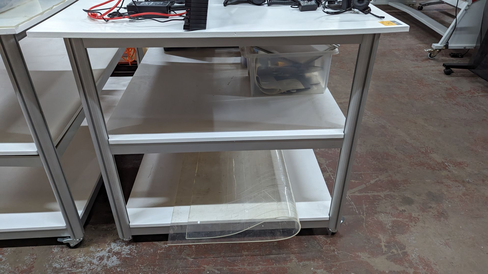 Mobile worktable with 2 shelves underneath the main work surface. Includes protective sheet in very - Image 6 of 8