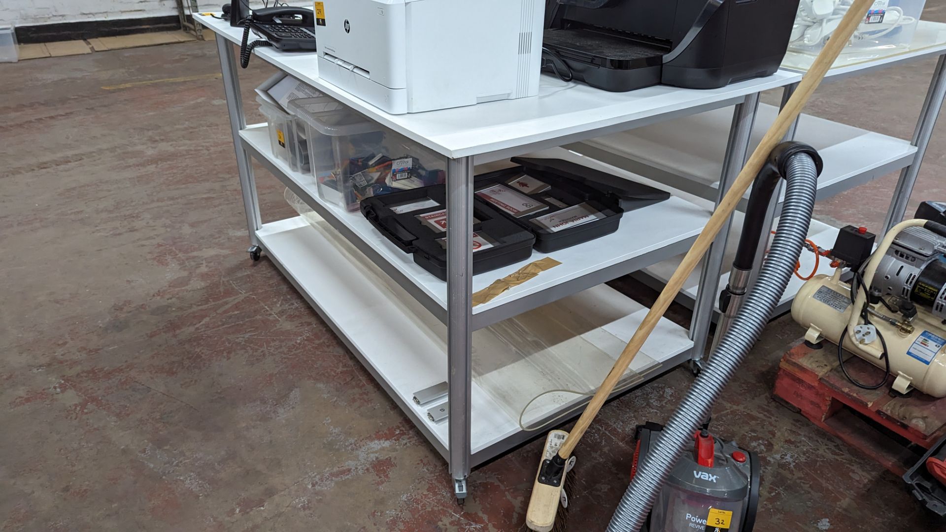 Mobile worktable with 2 shelves underneath the main work surface. Includes protective sheet in very - Image 8 of 8