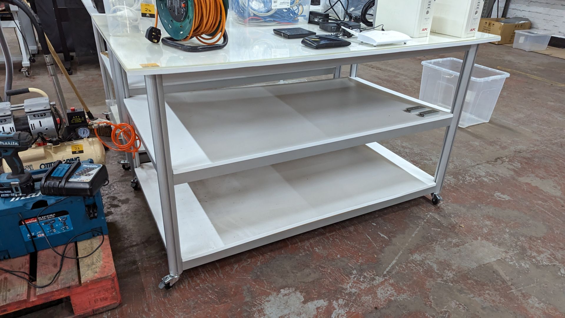 Mobile worktable with 2 shelves underneath the main work surface. Includes protective sheet in very - Image 3 of 9