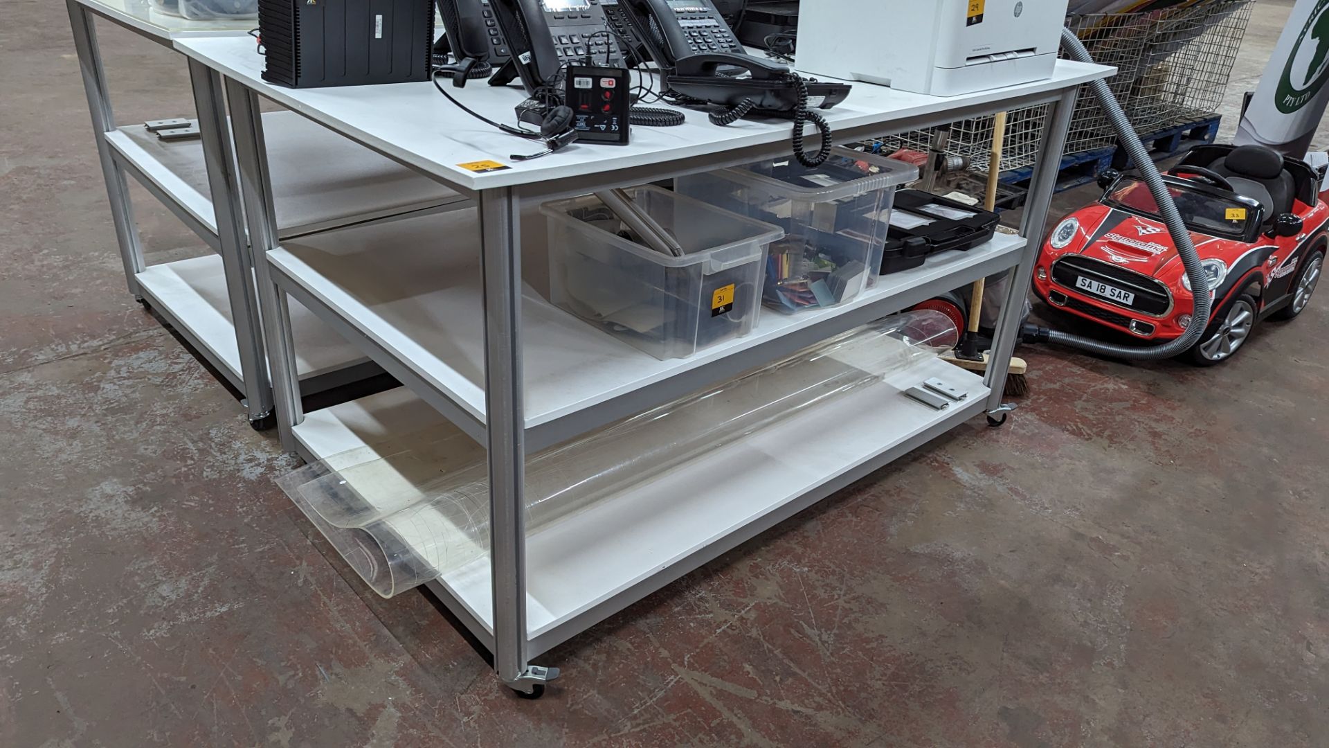 Mobile worktable with 2 shelves underneath the main work surface. Includes protective sheet in very - Image 2 of 8