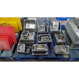 The contents of a pallet of assorted stainless steel trays, dishes, lids & more - approximately 43 i