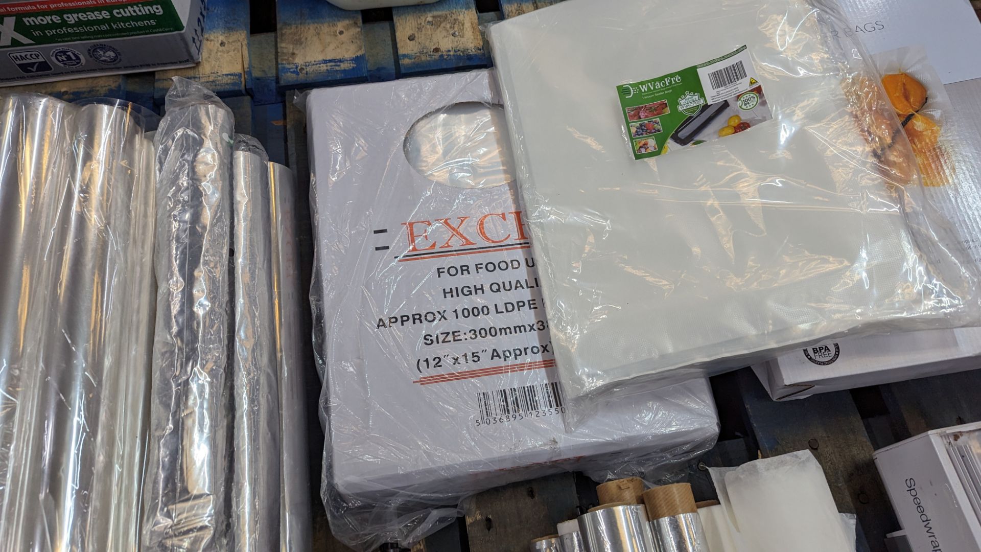 The contents of a pallet of vacuum sealer bags, speed wrap dispensers, silver paper, clear paper & m - Image 8 of 9
