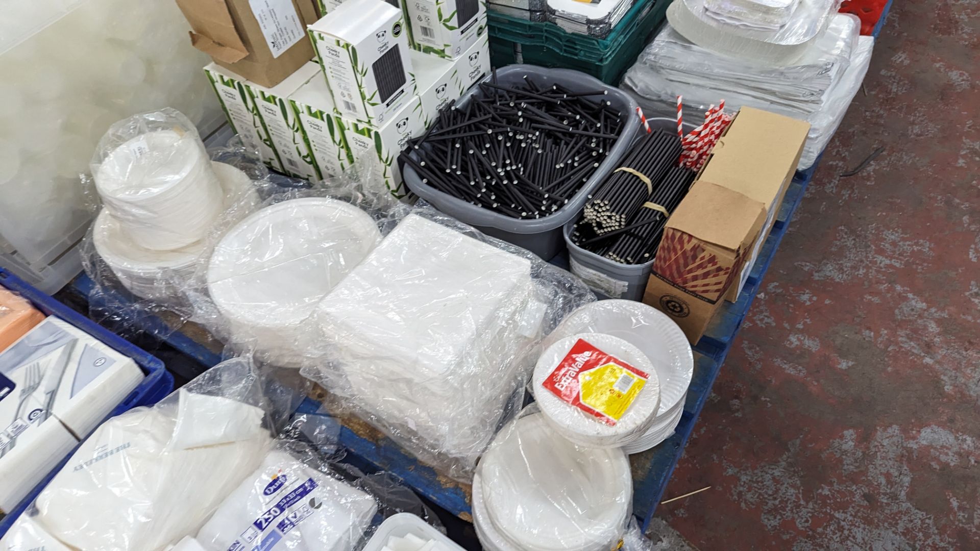 The contents of a pallet of disposable items including foil trays & lids, straws, plates & more. NB - Image 9 of 12