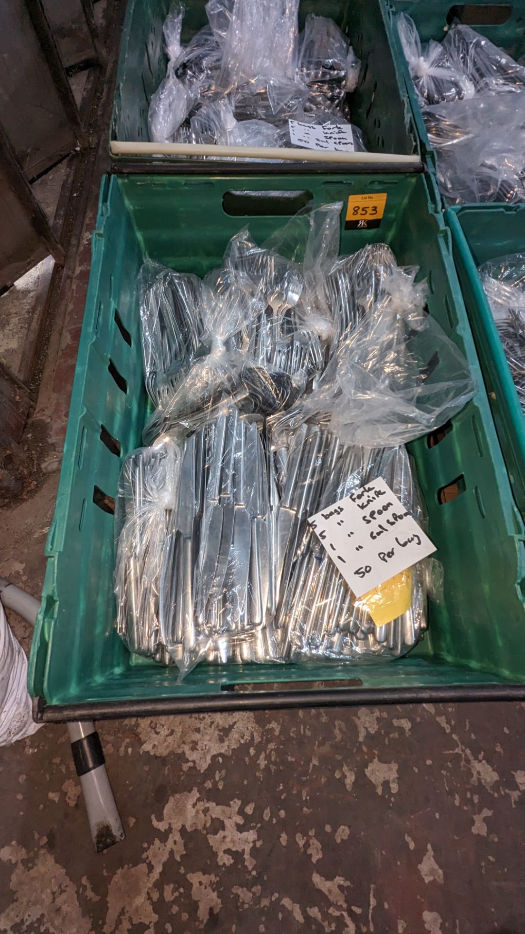 The contents of a crate of cutlery. Estimated 600 pieces in total comprising 5 bags each with 50 fo