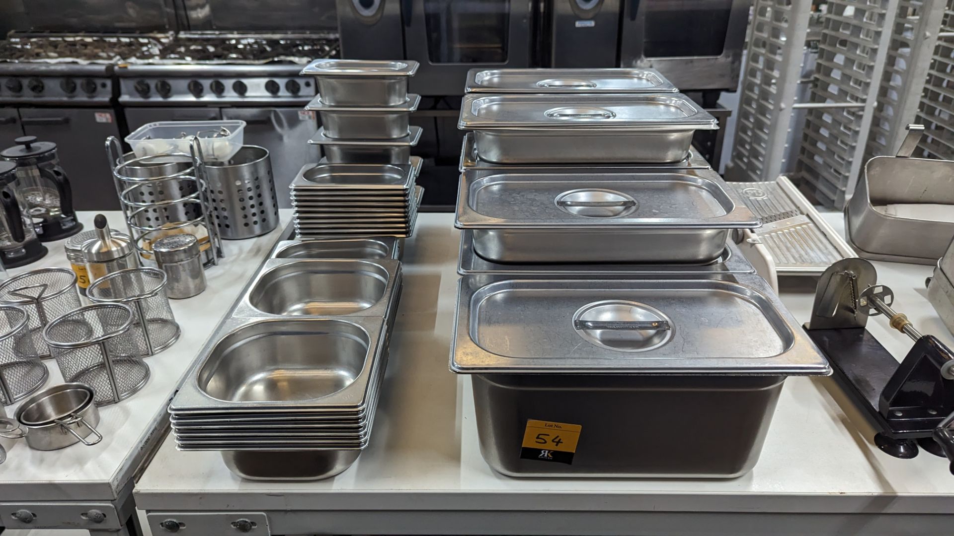 Large quantity of stainless steel storage receptacles, plus quantity of lids for use with same. In