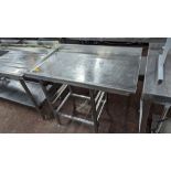 Stainless steel table for use with commercial dishwashers incorporating tray holding below. Max ext