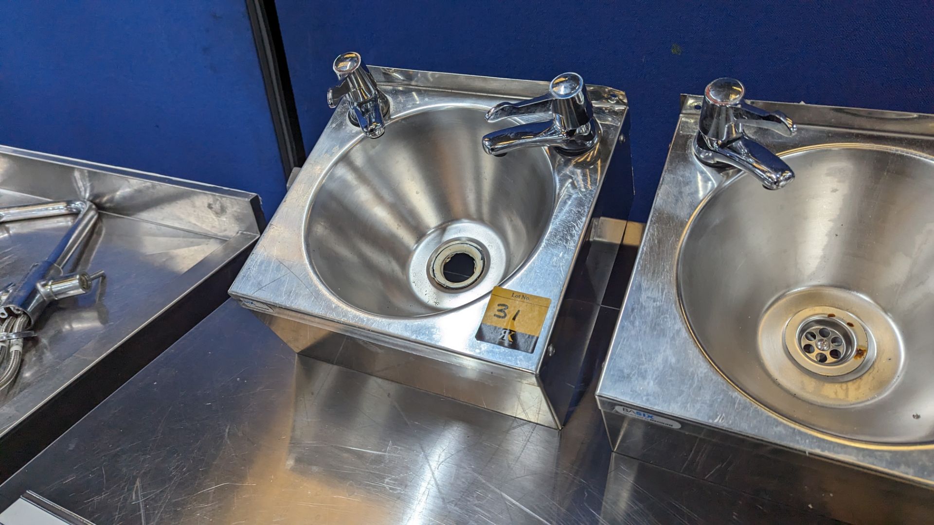 Stainless steel wall mountable handwash basin including twin tap system